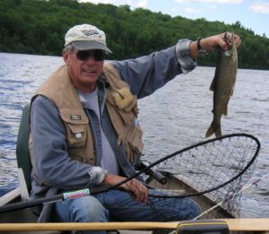 Dan holding a freshly caught trout