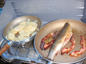 Trout being cooked for suppa